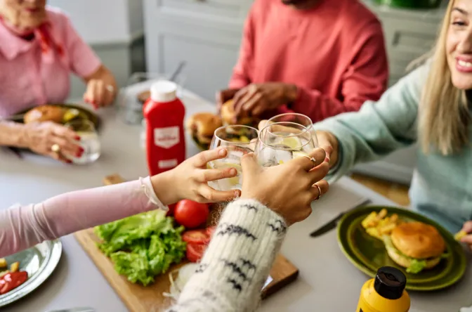Girl and her mother eating in the kitchen