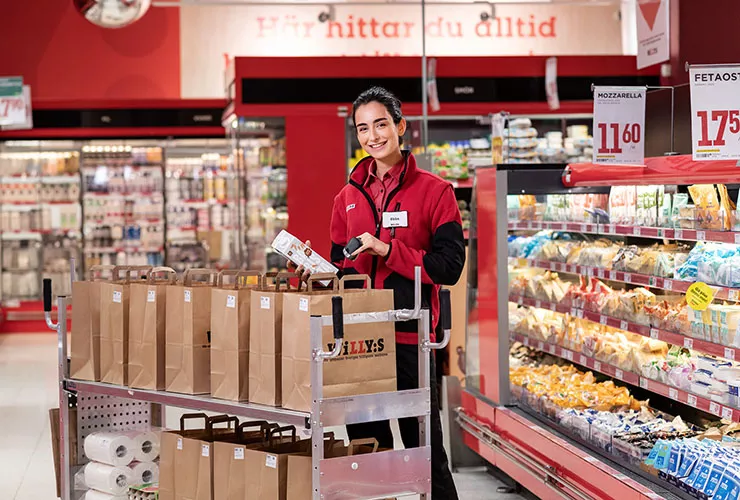 Employees in store smiling