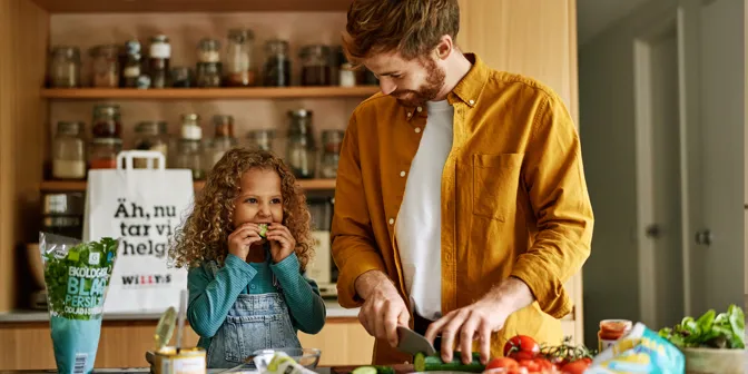 Girl and her mother eating in the kitchen